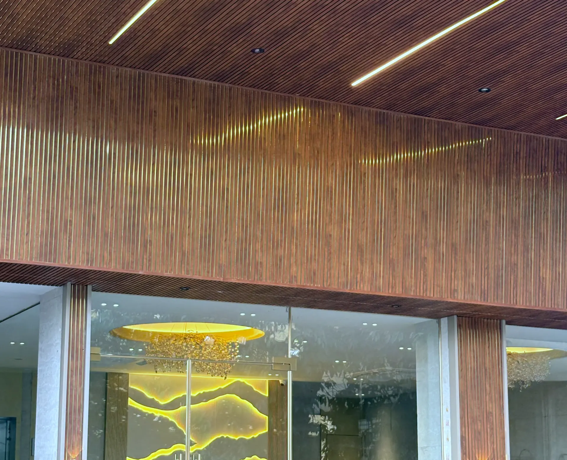 The ribbed timber entrance canopy above the lobby glazing