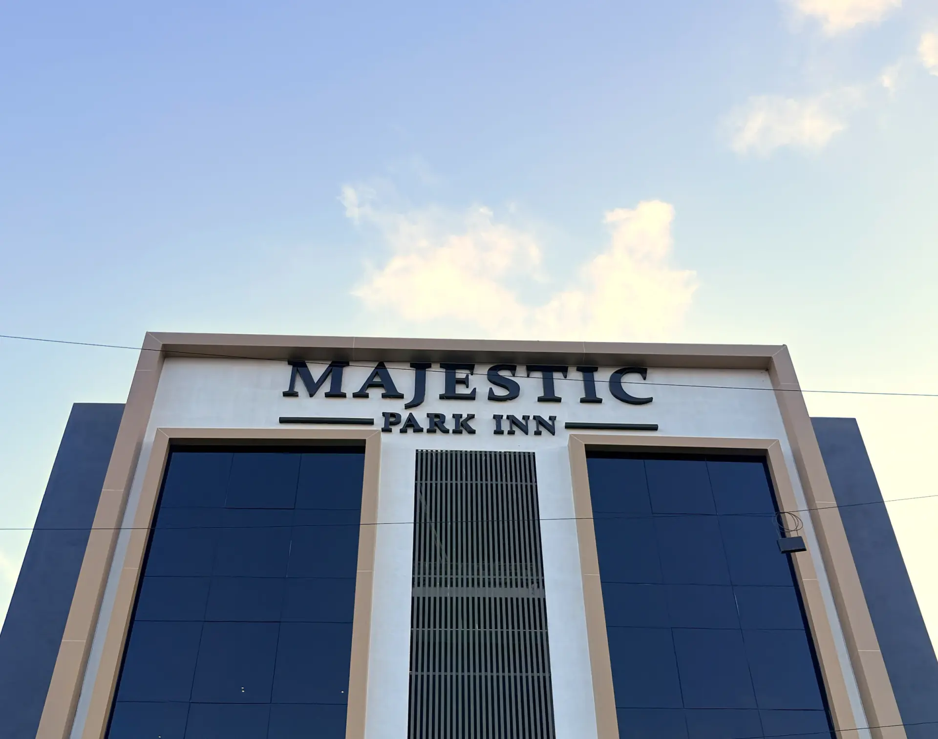 The Majestic Park Inn nameplate on the building facade